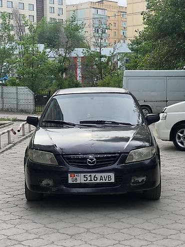 Mazda 323: 2002 г., 1.3 л, Механика, Бензин, Хэтчбэк