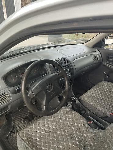 Продажа авто: Mazda 323: 2000 г., Механика, Бензин, Хэтчбэк — 5