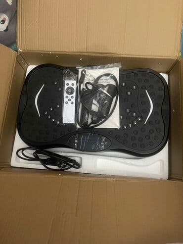 домашний велотренажёр: Виброплатформа черного цвета для домашних тренировок. Оснащена 5 — 4