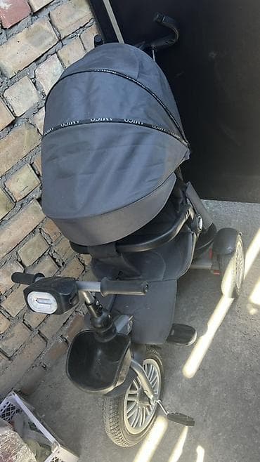 Детский трехколесный велосипед‑коляска (трансформер) с родительской