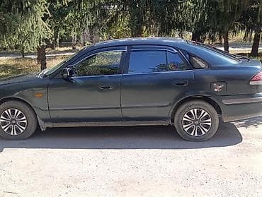 кочкор авто: Mazda 323: 1999 г., 1.8 л, Кол менен иштөөчү, Бензин, Седан — 9