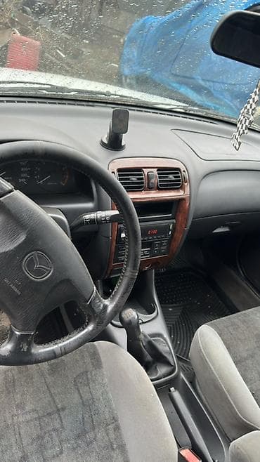 ас машина: Mazda Familia: 1999 г., 1.8 л, Механика, Бензин, Универсал — 5