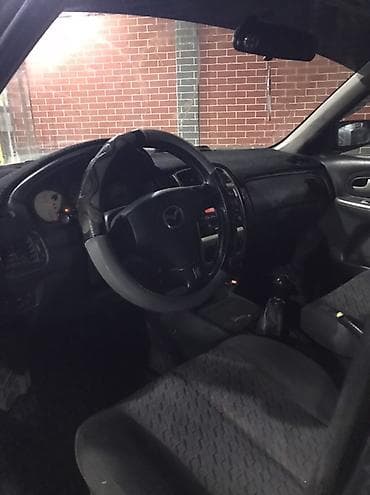 bmw e34 1995: Mazda Familia: 2001 г., Универсал — 8