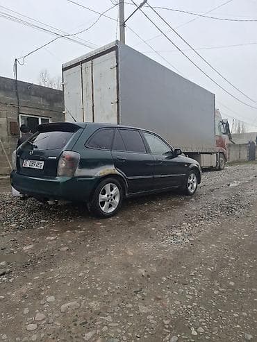 mini copper: Mazda 323: 2002 г., 1.6 л, Механика, Универсал — 2