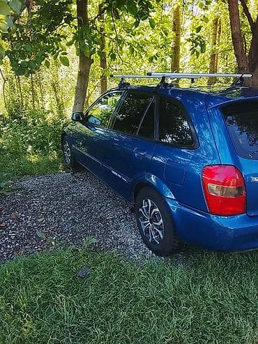 Mazda: Mazda 323: 2001 г., Механика, Бензин, Универсал — 2