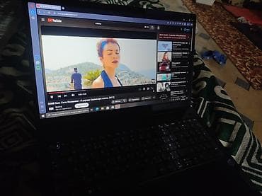 watch 11: Ноутбук Lenovo в черном корпусе. Оснащен процессором Intel Celeron — 4
