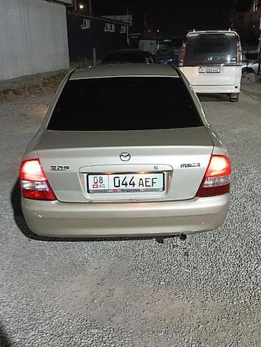 мотор 323: Mazda 323: 2001 г., Седан — 6