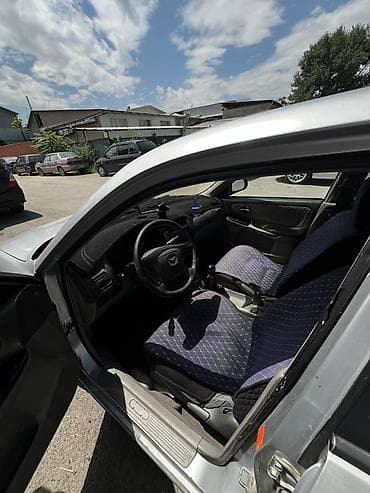 чехлы на морнинг: Mazda Capella: 2001 г., 2 л, Механика, Бензин, Седан — 7