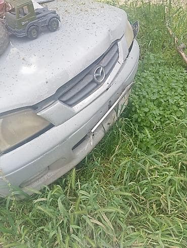аудио касета: Mazda 2: 2003 г., 1.3 л, Автомат, Бензин, Хэтчбэк — 5