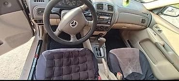 авто крепеж: Mazda Protege: 2001 г., Автомат, Бензин, Седан — 6