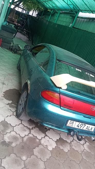 алмашаи: Mazda 323: 1994 г., 1.5 л, Механика, Бензин, Хэтчбэк — 5