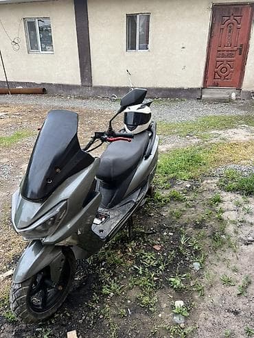 скутор новый: Скутер/максискутер серо‑черного цвета Описание: - Городской скутер с — 2