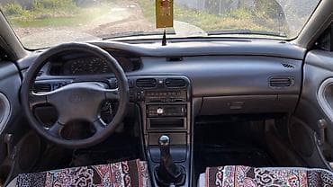 тоо машина: Mazda Cronos: 1995 г., 1.8 л, Кол менен иштөөчү, Бензин, Лифтбек — 6