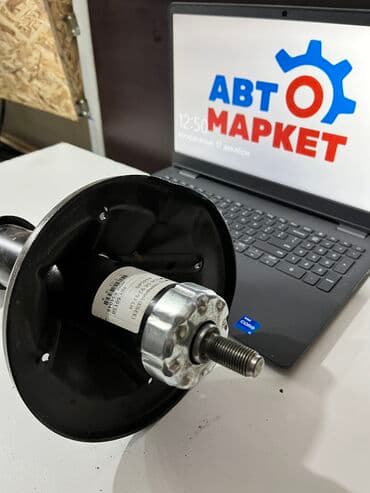 ge: Передний амортизатор Mazda 1997 г., Новый — 3