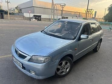 e 303: Mazda 323: 2001 г., 1.6 л, Механика, Бензин, Универсал — 3