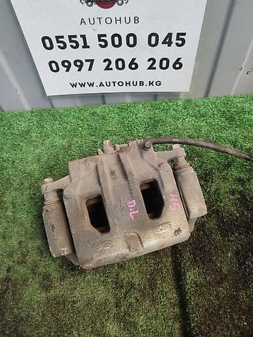 Суппорты: Передний левый суппорт Kia 2016 г., Б/у, Оригинал — 1