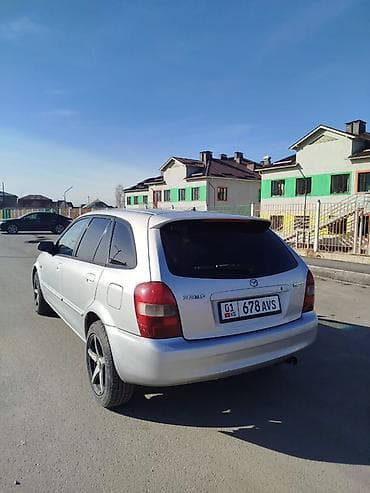 Унаа: Mazda 323: 2001 г., 1.6 л, Кол менен иштөөчү, Бензин, Хетчбек — 4