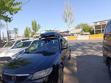 Mazda 323: 2002 г., 1.6 л, Автомат, Бензин, Универсал — 4