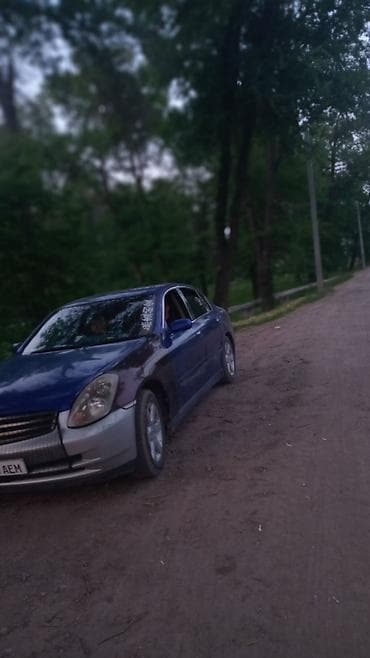 infinity nado: Седан бизнес‑класса синего цвета с серебристыми элементами переднего — 1