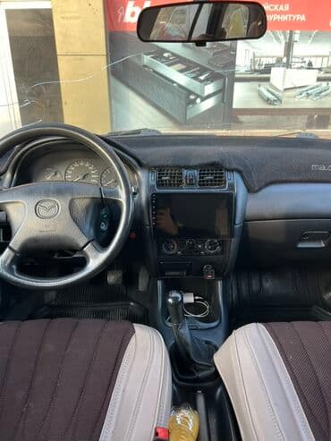 домик вагон: Mazda 626: 1998 г., 1.8 л, Механика, Бензин, Универсал — 7