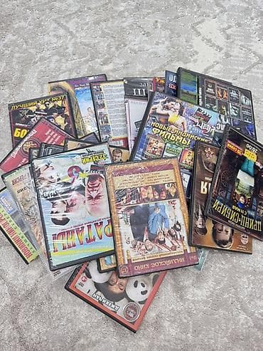 Коллекция DVD-дисков с фильмами и сериалами различных жанров. -