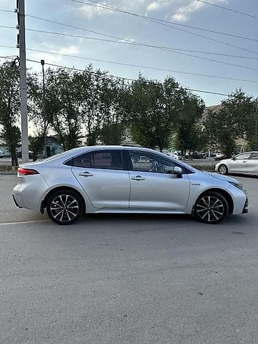 byd e2 2023: Toyota Corolla: 2021 г., 1.8 л, Автомат, Гибрид, Седан — 4