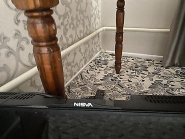колонки 5 1: Телевизор NISVA с диагональю около 32–37". Плоская LED‑панель — 2