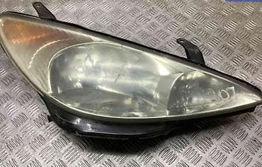 Детали электрики авто: Передняя левая фара Peugeot Оригинал — 1