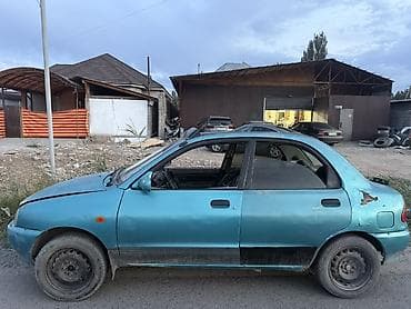 1992: Mazda 121: 1992 г., Механика, Бензин, Седан — 2