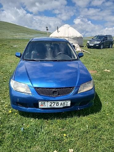 man 8: Mazda 323: 2003 г., 1.6 л, Механика, Бензин, Хэтчбэк — 6