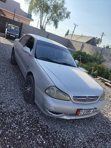 b v d: Kia : 1999 г., Механика, Бензин, Седан — 2