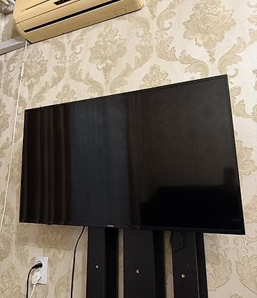 Телевизор NISIN, диагональ примерно 43–50". Тонкие рамки, плоская