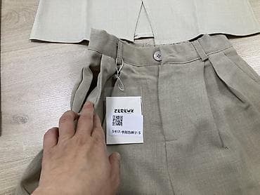 Джинсы: Женский комплект из двух предметов: топ без рукавов и широкие брюки — 5