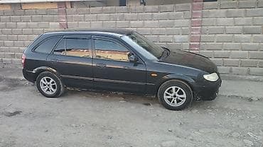 rf 2: Mazda Familia универсал, черный цвет кузова. Кузов: - Универсал — 2