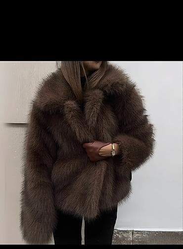 Шуба из натурального меха в классическом коричневом оттенке. - Пышный