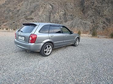 daf 480: Mazda 323: 2002 г., 1.6 л — 5