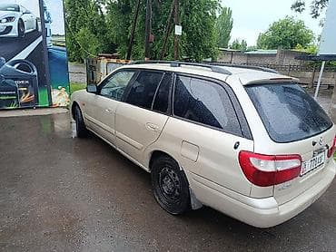 Транспорт: Mazda Capella: 2002 г., 1.8 л, Механика, Бензин, Универсал — 5