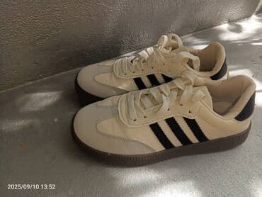 прокат национальных костюмов для детей: Кроссовки унисекс, светло‑кремовые с черными боковыми полосками. - — 5