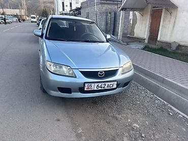 Транспорт: Mazda 323: 2001 г., 1.6 л, Механика, Бензин, Универсал — 4