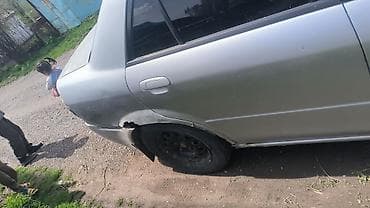 e6 3: Mazda Familia: 2003 г., Автомат, Седан — 2