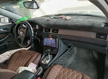 домкрат на ауди: Автомобиль Audi A6 серебристого цвета, представленный в кузове седан — 1