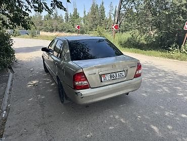 Продажа авто: Mazda 323: 2002 г., 1.6 л, Автомат, Бензин, Седан — 3