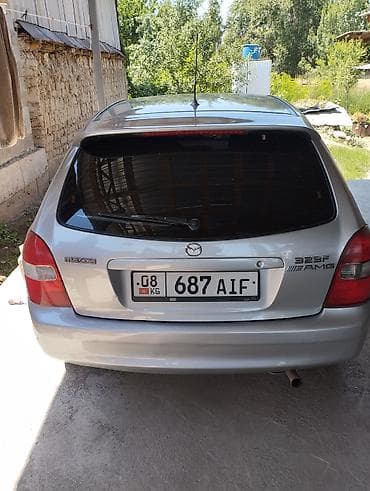 люк 124: Mazda 323: 2003 г., Хэтчбэк — 2