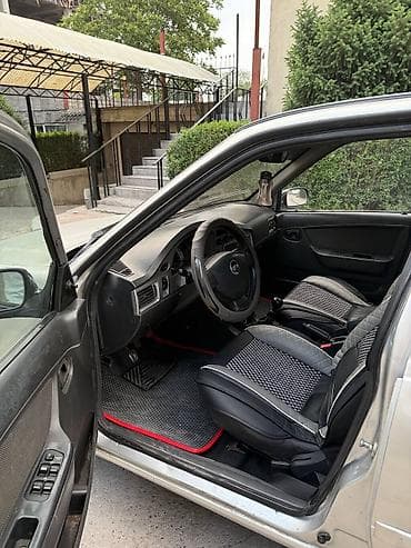 devo matiz: Daewoo Nexia: 2012 г., Седан — 6