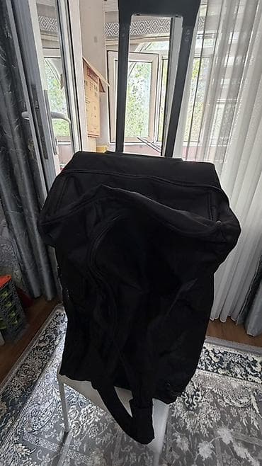 pull and beer: Большая дорожная сумка на колесах, черная. Характеристики: - Формат — 2