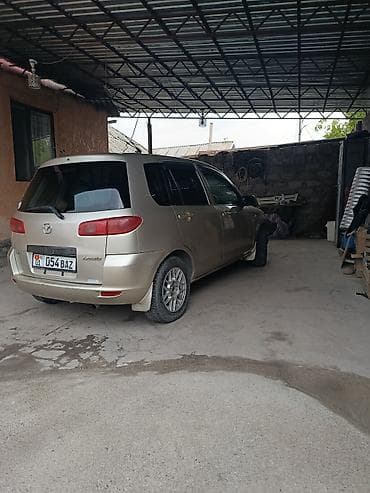 Транспорт: Mazda Demio: 2003 г., Бензин, Хэтчбэк — 6