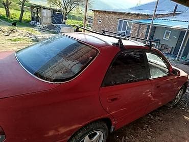 кирг шёлк: Mazda 323: 1995 г., Седан — 5