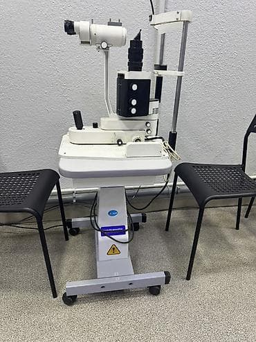 бинокуль: Щелевая лампа (офтальмологический биомикроскоп) на регулируемом столе — 2