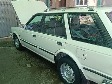 машина byd e2: Nissan Sunny: 1990 г., Бензин, Универсал — 3