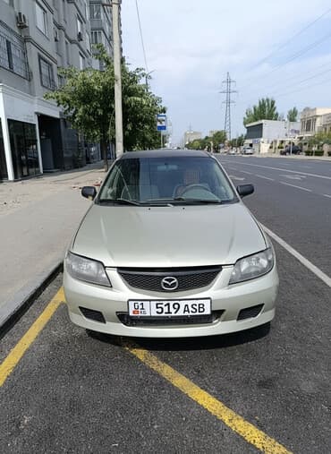 Mazda 323: 2002 г., 2 л, Механика, Бензин, Седан